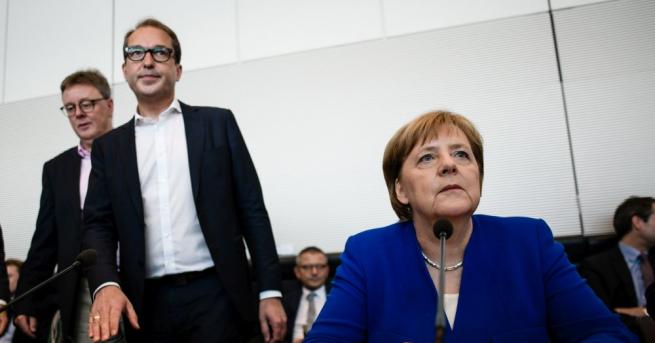 Германската канцлерка Ангела Меркел и вътрешният министър в нейното коалиционно