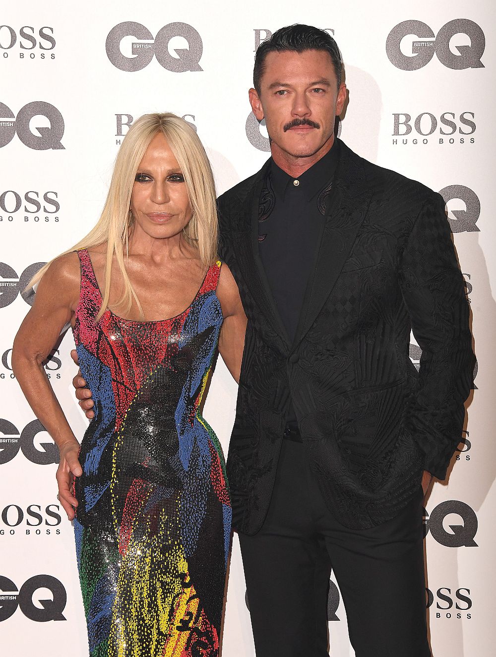 Донатела Версаче и Люк Еванс