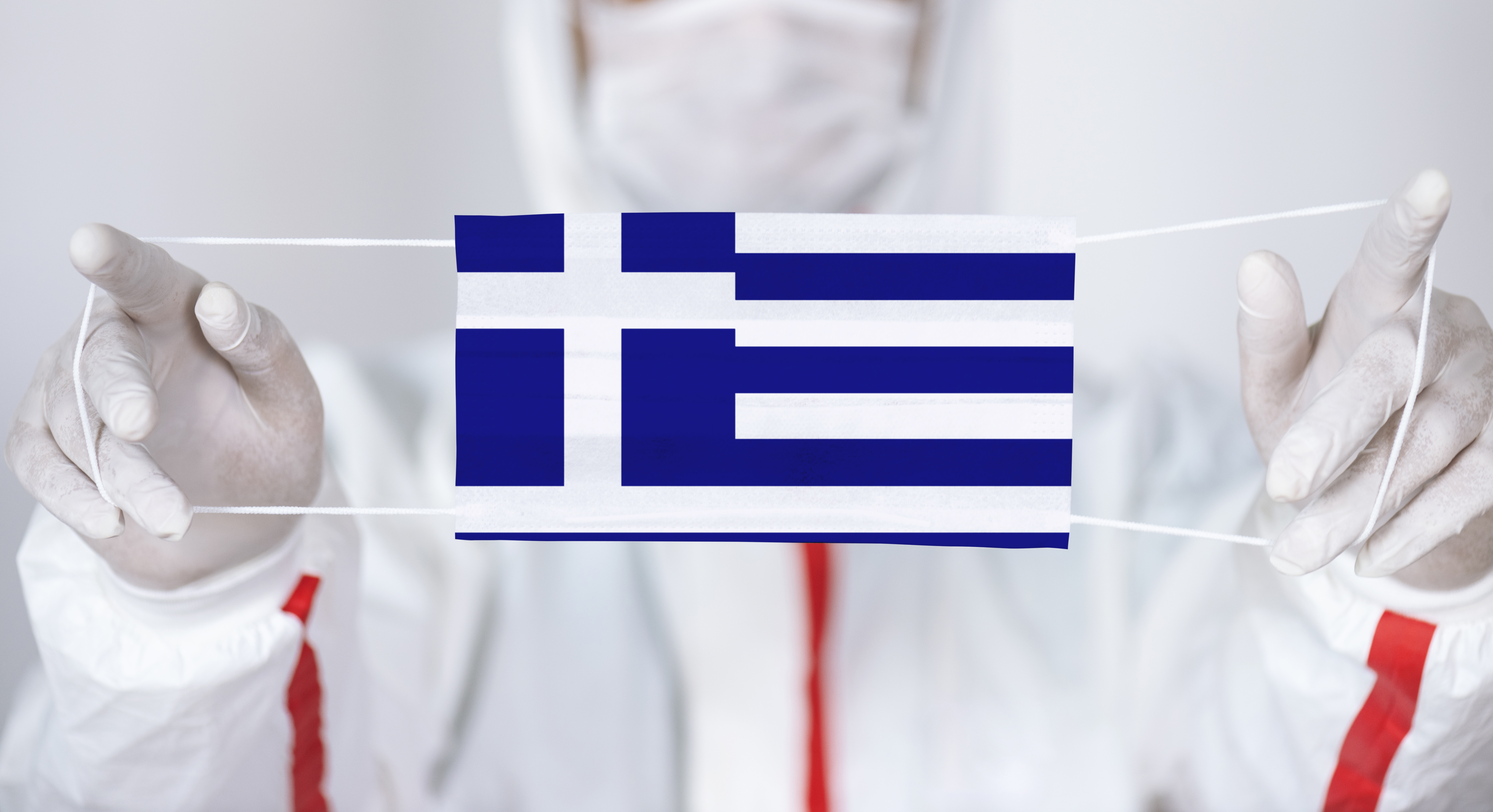 Доктор из Греции с флагом